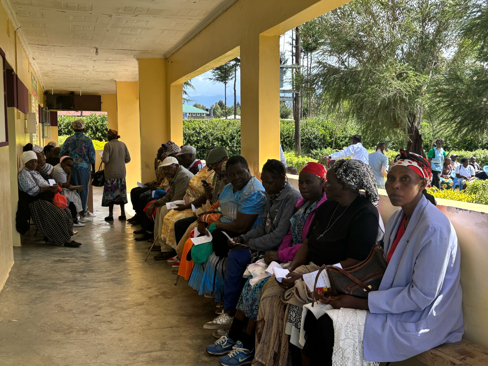 Community members receiving healthcare during a free clinic outreach