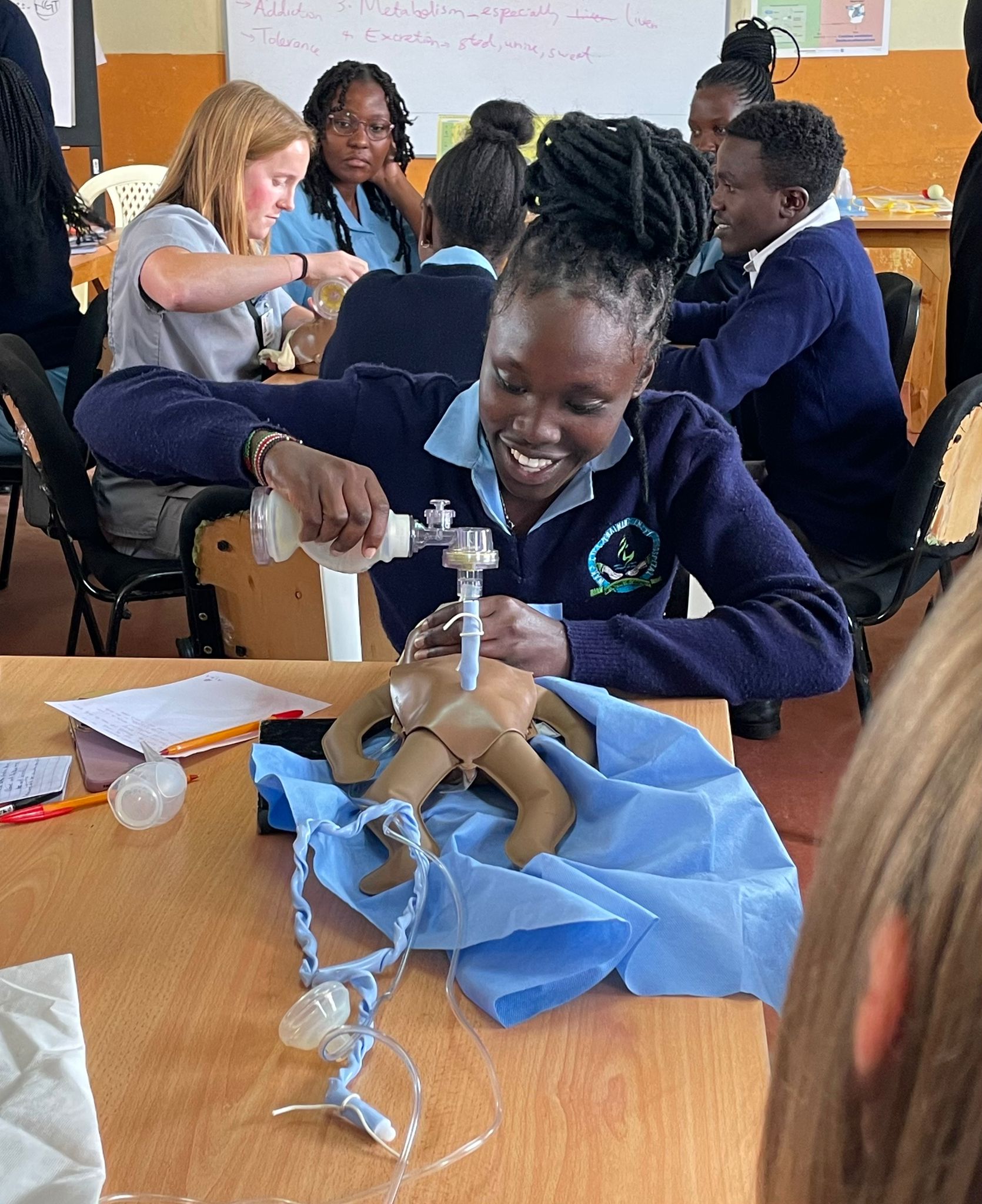 WAKA nursing student practicing infant resuscitation techniques
