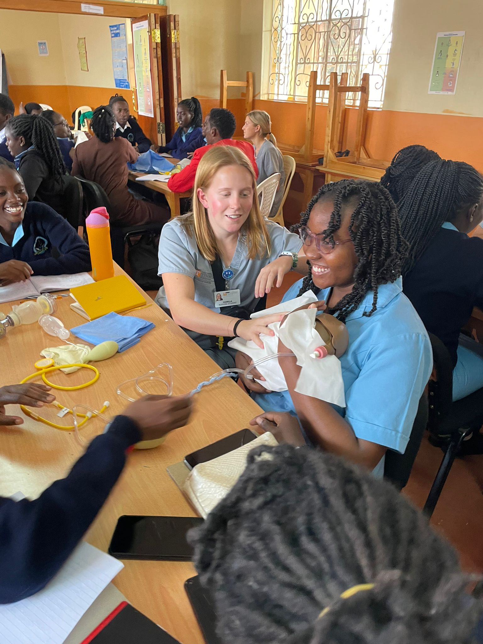 UT and WAKA students practicing infant care simulation together